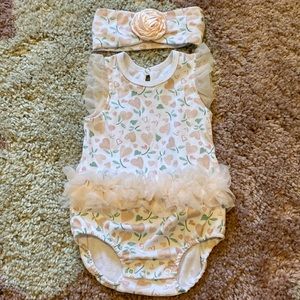 Onesie with ruffle on sleeves and around waist